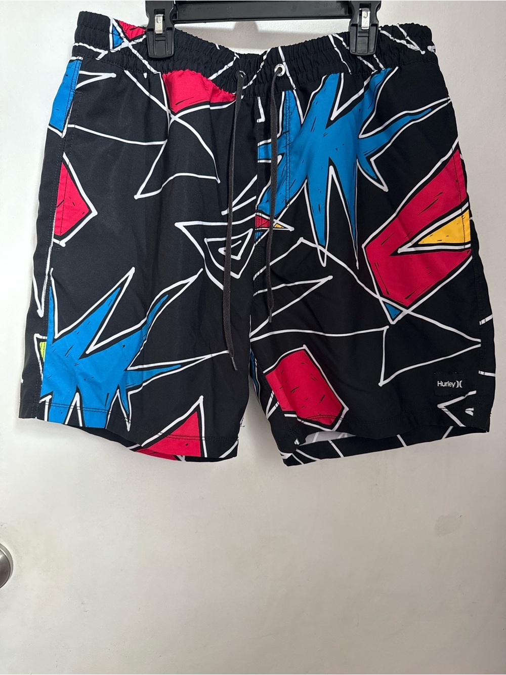 Hurley Black Swim Board Shorts with Blue, Red, and Yellow Graphic Shapes